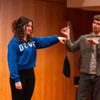 trent james comedian with student holding a bag